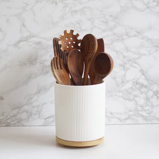 wooden kitchen utensil set with ceramic pot