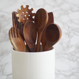 wooden kitchen utensil set with ceramic pot