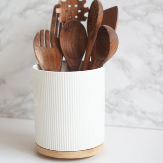wooden kitchen utensil set with ceramic pot