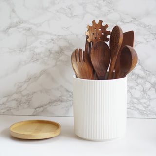 wooden kitchen utensil set with ceramic pot