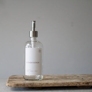 Clear glass bottle with silver dispenser