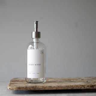 Clear glass bottle with silver dispenser
