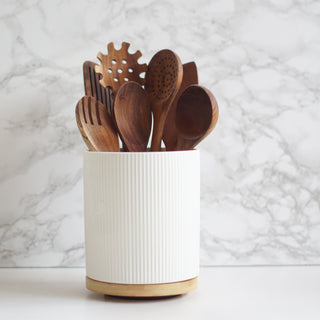 wooden kitchen utensil set with ceramic pot