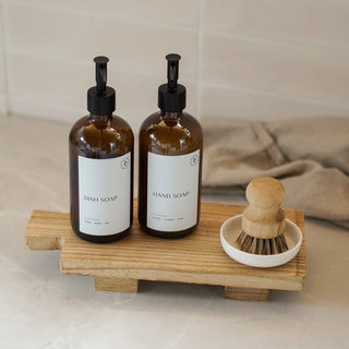 wooden board with soap dispenser bottles as sink tidy