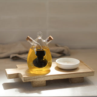 wooden paddle board with oil and vinegar bottle